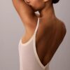 Body minimalista em malha até à coxa Body minimalista em malha até à coxa