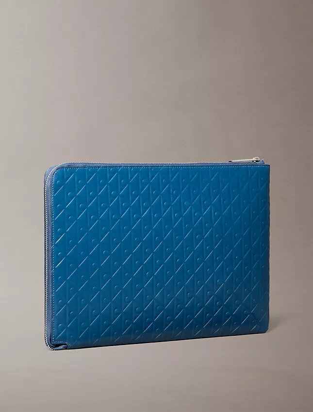 Bolsa com fecho de correr e logótipo em todo o tecido Bolsa com fecho de correr e logótipo em todo o tecido