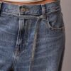 Calças de jeans largas de cintura baixa com cinto
