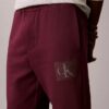 Calças de treino com grafismo Monogram em camadas de velo Calças de treino com grafismo Monogram em camadas de velo
