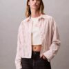 Camisa curta de corte largo com riscas e botões Camisa curta de corte largo com riscas e botões