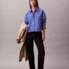 Camisa curta de corte largo com riscas e botões Camisa curta de corte largo com riscas e botões