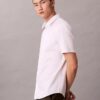 Camisa de algodão elástico com botões e corte justo Camisa de algodão elástico com botões e corte justo