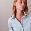 Camisa de algodão às riscas com botões e corte descontraído Camisa de algodão às riscas com botões e corte descontraído