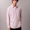 Camisa de algodão às riscas com botões e corte descontraído Camisa de algodão às riscas com botões e corte descontraído