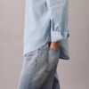 Camisa de algodão às riscas com botões e corte descontraído Camisa de algodão às riscas com botões e corte descontraído