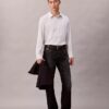 Camisa de botões com corte descontraído em mistura de viscose às riscas Camisa de botões com corte descontraído em mistura de viscose às riscas