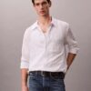Camisa de botões com corte descontraído, em tecido frisado com riscas tingidas no fio Camisa de botões com corte descontraído, em tecido frisado com riscas tingidas no fio