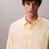Camisa de popeline lavado com botões e corte descontraído Camisa de popeline lavado com botões e corte descontraído