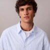 Camisa de popeline lavado com riscas tingidas no fio Camisa de popeline lavado com riscas tingidas no fio