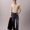 Camisa de riscas, corte justo e elástica, com botões Camisa de riscas, corte justo e elástica, com botões