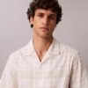 Camisa de xadrez em mistura de linho com corte descontraído e botões Camisa de xadrez em mistura de linho com corte descontraído e botões