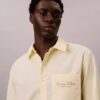 Camisa Oxford com botões e logótipo gráfico desbotado Camisa Oxford com botões e logótipo gráfico desbotado