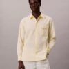Camisa Oxford com botões e logótipo gráfico desbotado Camisa Oxford com botões e logótipo gráfico desbotado