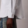 Camisa Oxford com botões e logótipo gráfico desbotado Camisa Oxford com botões e logótipo gráfico desbotado