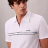 Camisa polo com fecho de correr de um quarto e debrum contrastante