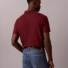 Camisa polo com fecho de correr de um quarto e debrum contrastante