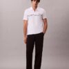 Camisa polo com fecho de correr de um quarto e debrum contrastante