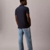 Camisa polo com fecho de correr de um quarto e debrum contrastante