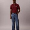 Camisa polo com fecho de correr de um quarto e debrum contrastante