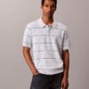 Camisa polo de malha às riscas em algodão Camisa polo de malha às riscas em algodão