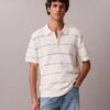 Camisa polo de malha às riscas em algodão Camisa polo de malha às riscas em algodão