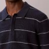 Camisa polo de malha às riscas em algodão Camisa polo de malha às riscas em algodão