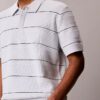 Camisa polo de malha às riscas em algodão Camisa polo de malha às riscas em algodão