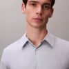 Camisa Slim com botões e padrão jacquard geométrico Camisa Slim com botões e padrão jacquard geométrico