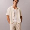 Camisola com botões e ponto em malha Camisola com botões e ponto em malha