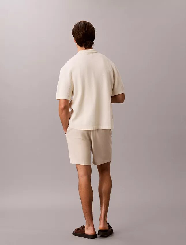 Camisola com botões e ponto em malha Camisola com botões e ponto em malha