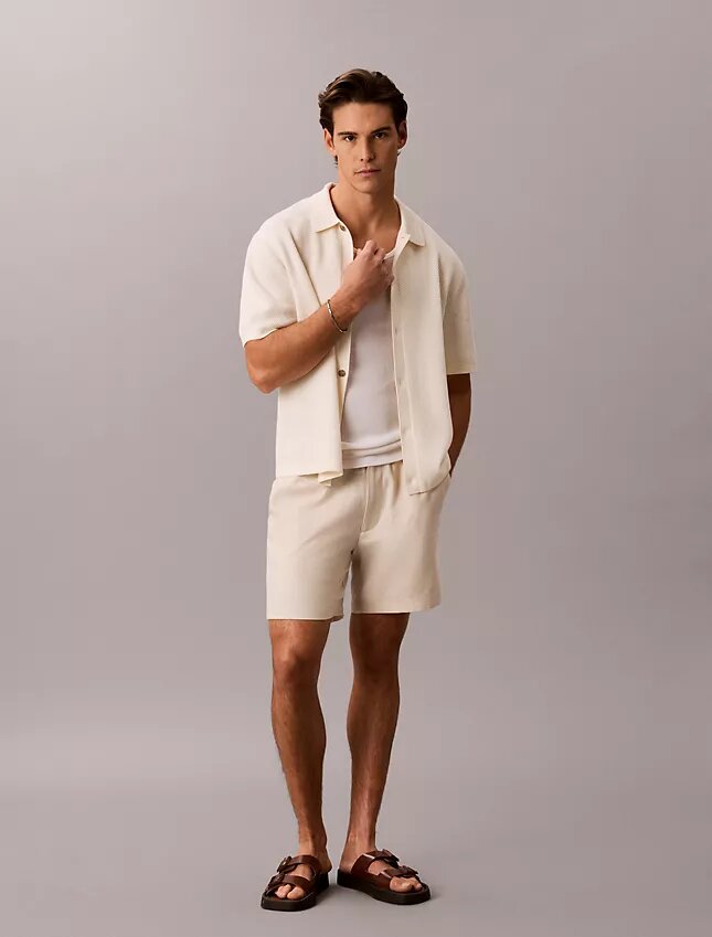 Camisola com botões e ponto em malha Camisola com botões e ponto em malha