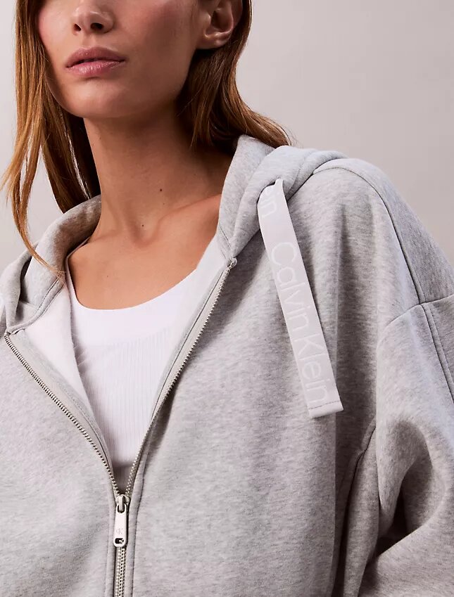 Camisola com capuz descontraída em malha polar com fecho e fita com logótipo Camisola com capuz descontraída em malha polar com fecho e fita com logótipo