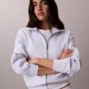 Camisola com fecho completo e fita com logótipo Camisola com fecho completo e fita com logótipo