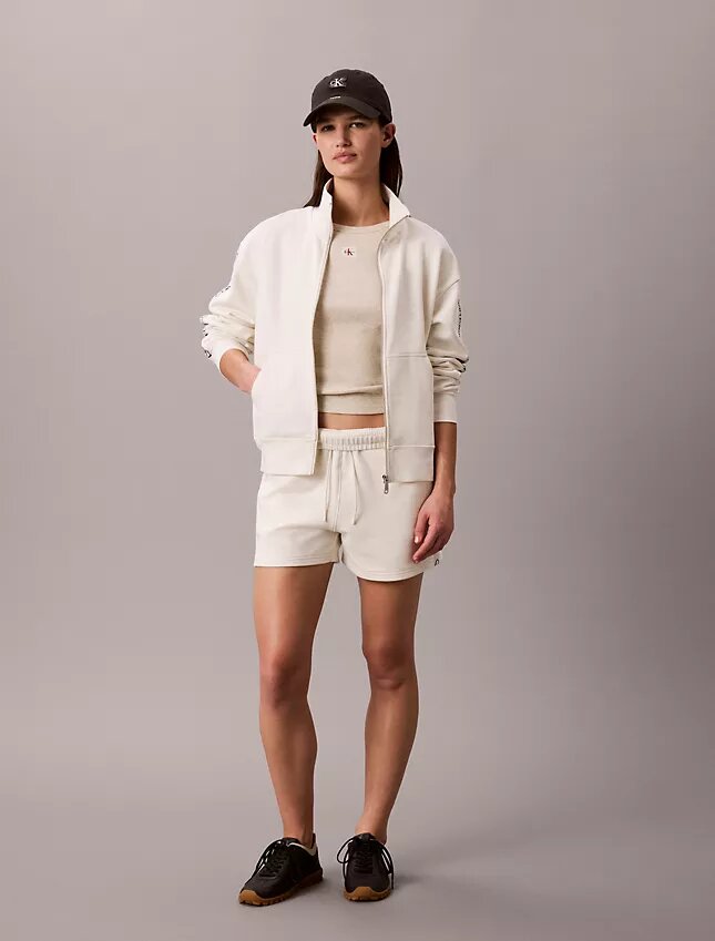 Camisola com fecho completo e fita com logótipo Camisola com fecho completo e fita com logótipo