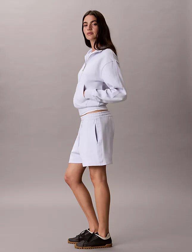 Camisola com fecho completo e fita com logótipo Camisola com fecho completo e fita com logótipo