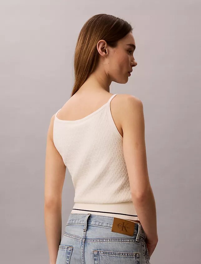 Camisola sem mangas em malha trançada com Monologo tecido Camisola sem mangas em malha trançada com Monologo tecido