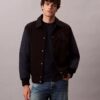 Casaco bomber universitário em nylon e algodão Casaco bomber universitário em nylon e algodão