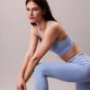Leggings desportivas modernas de cintura alta com logótipo e comprimento 7/8 Leggings desportivas modernas de cintura alta com logótipo e comprimento 7/8