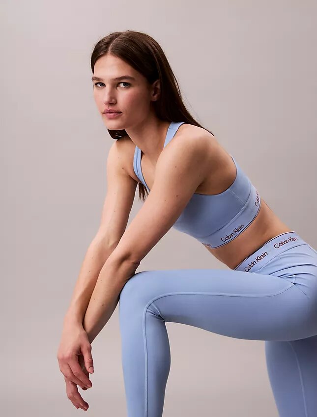 Leggings desportivas modernas de cintura alta com logótipo e comprimento 7/8 Leggings desportivas modernas de cintura alta com logótipo e comprimento 7/8