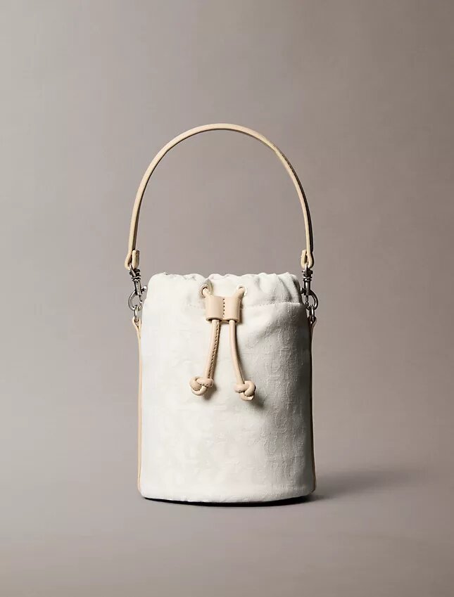 Mala tipo balde com Monogram em toda a superfície Mala tipo balde com Monogram em toda a superfície