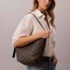 Mala tipo balde em jacquard com logótipo em todo o tecido e bolsa interior Mala tipo balde em jacquard com logótipo em todo o tecido e bolsa interior