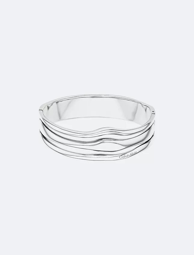 Pulseira articulada com forma fluida e escultural Pulseira articulada com forma fluida e escultural