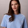 T-shirt Boxy com grafismo Calvin Klein em letra cursiva T-shirt Boxy com grafismo Calvin Klein em letra cursiva