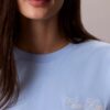 T-shirt Boxy com grafismo Calvin Klein em letra cursiva T-shirt Boxy com grafismo Calvin Klein em letra cursiva
