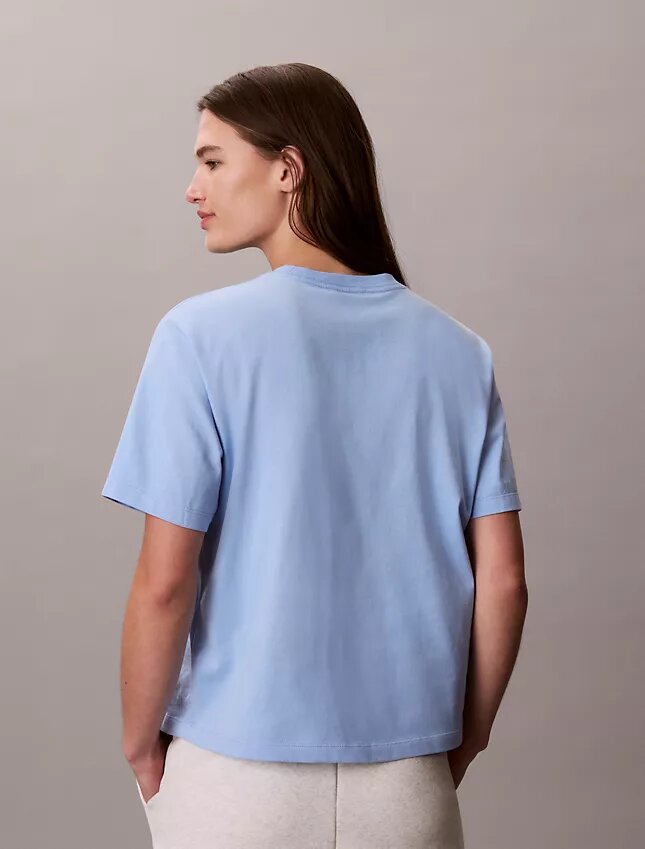 T-shirt Boxy com grafismo Calvin Klein em letra cursiva T-shirt Boxy com grafismo Calvin Klein em letra cursiva
