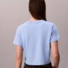 T-shirt curta e larga com logótipo em letra cursiva T-shirt curta e larga com logótipo em letra cursiva