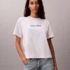 T-shirt de gola redonda com corte largo e logótipo padrão T-shirt de gola redonda com corte largo e logótipo padrão