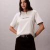 T-shirt de gola redonda com corte largo e logótipo padrão T-shirt de gola redonda com corte largo e logótipo padrão