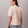 T-shirt de gola redonda com corte largo e logótipo padrão T-shirt de gola redonda com corte largo e logótipo padrão